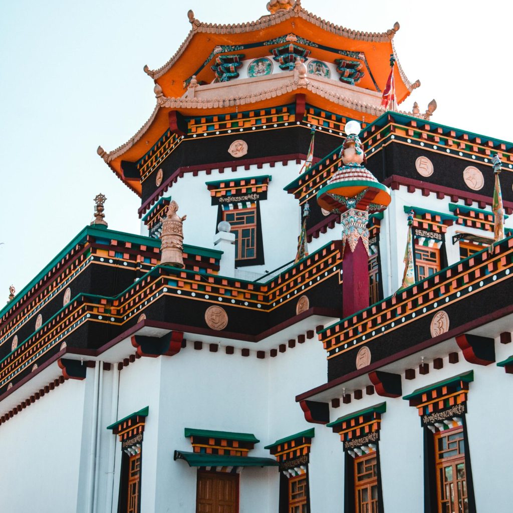 Vibrant and intricate architecture of a Buddhist temple captured on a sunny day.